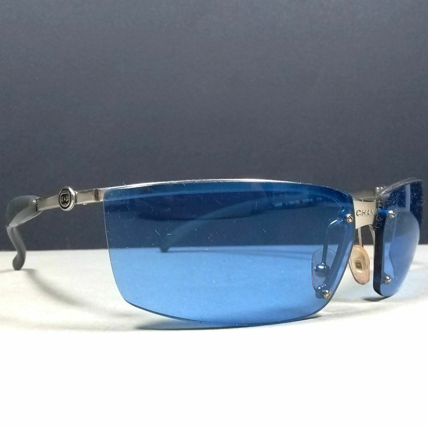 Chanel 4008 c.123/76 CC Logo Rimless Wrap Blue Lenses Designer Sunglasses –  Theo's Vintage